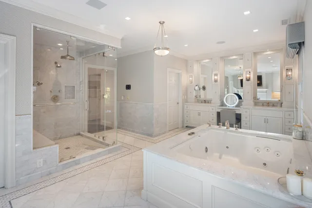 a bathroom with a bathtub and a shower