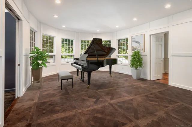a living room with furniture and a rug