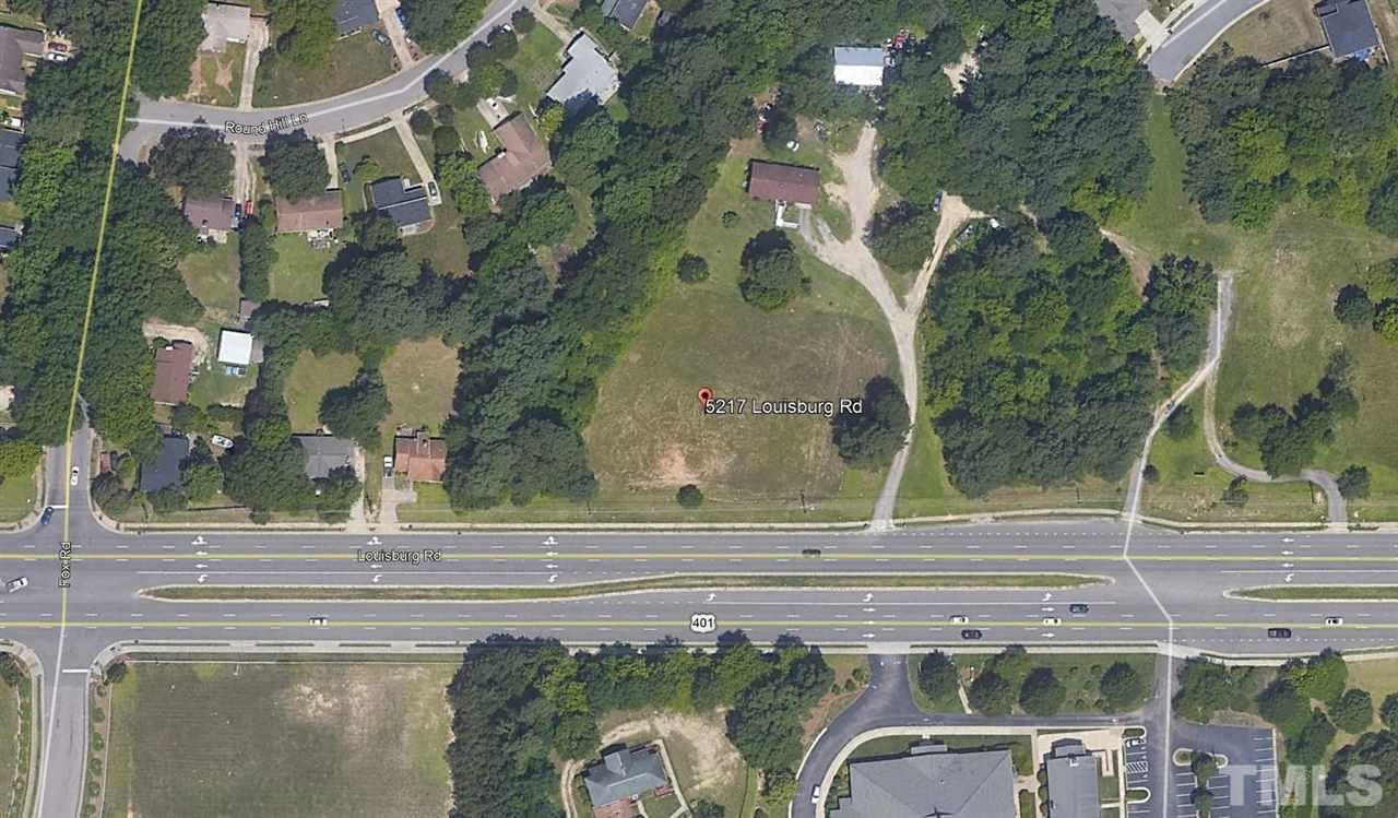 5217 Louisburg Road Raleigh, NC 27616 - Photo 7 of 7 an aerial view of a residential houses with yard