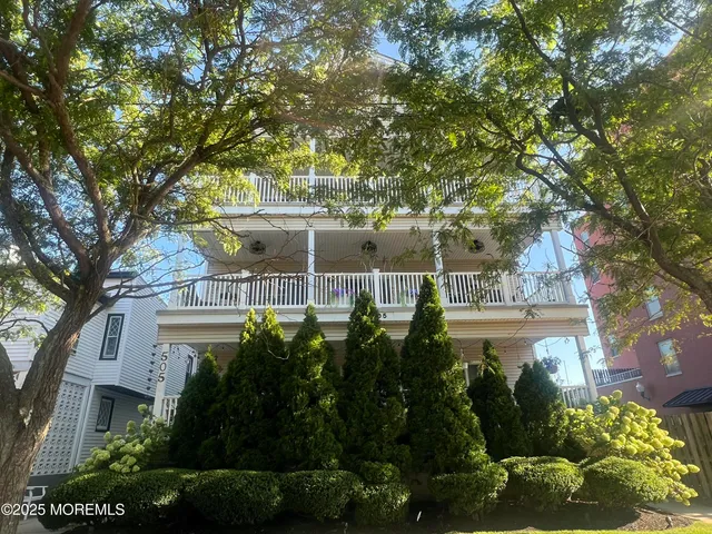 front view of a house with a garden