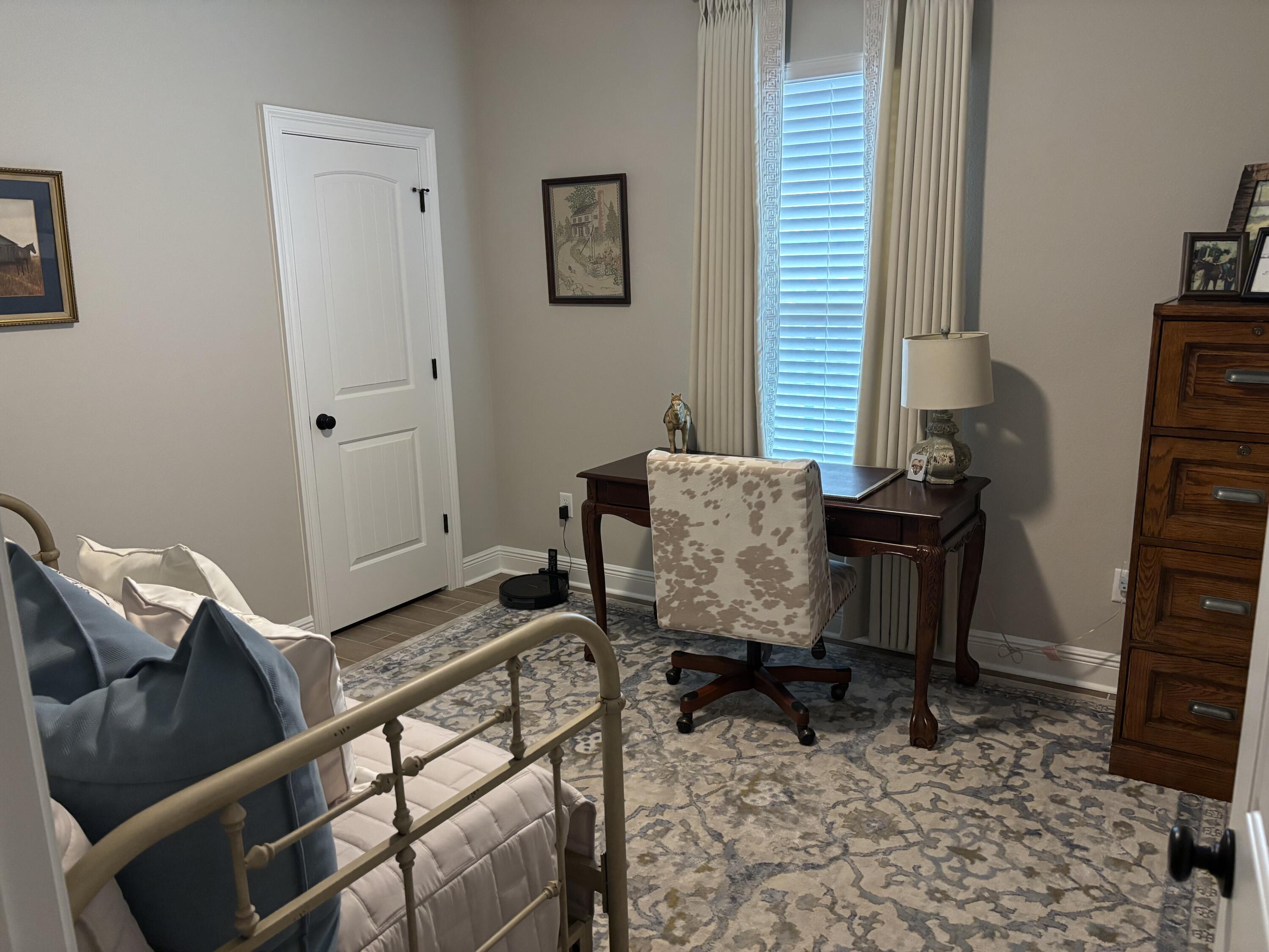 160 Hydrangea Boulevard Freeport, FL 32439 - Photo 5 of 6 a workspace with furniture and a window