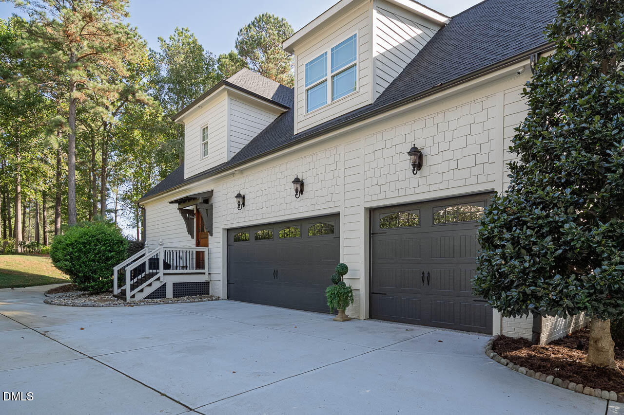 316 Chapel Ridge Drive Pittsboro, NC 27312 - Photo 16 of 69 a view of a house with a yard and garage