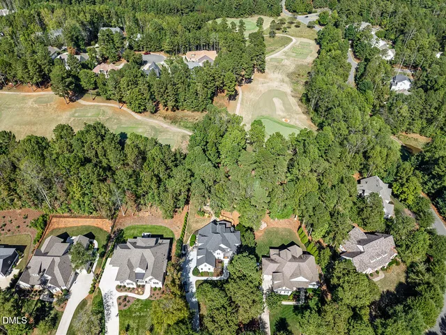 a view of a house with backyard porch and sitting area
