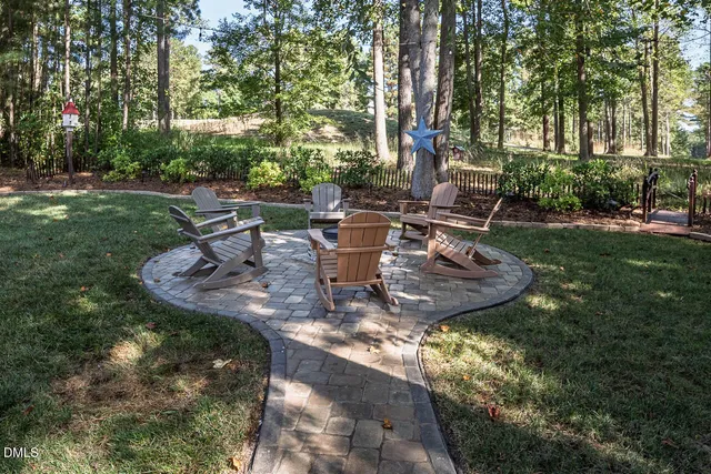a kitchen with white cabinets and appliances