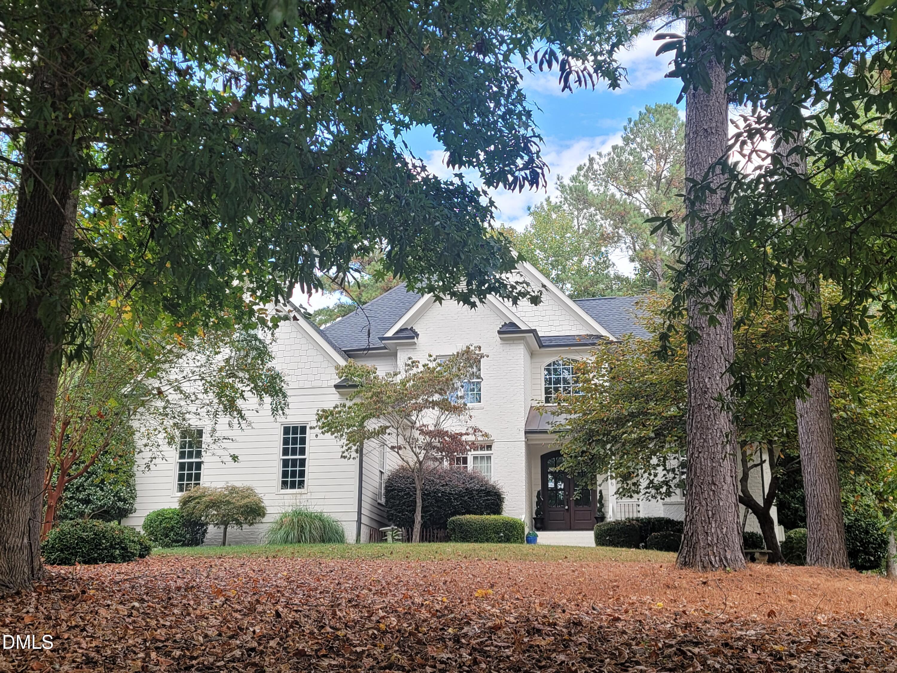316 Chapel Ridge Drive Pittsboro, NC 27312 - Photo 3 of 69 a view of a white house next to a road and yard
