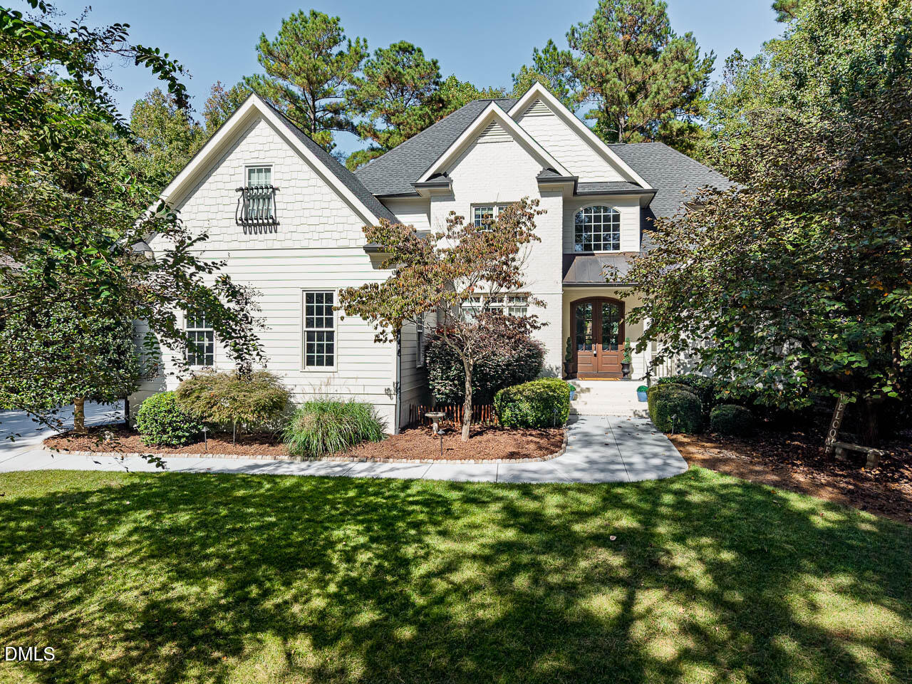 316 Chapel Ridge Drive Pittsboro, NC 27312 - Photo 4 of 69 a front view of a house with a yard and green space