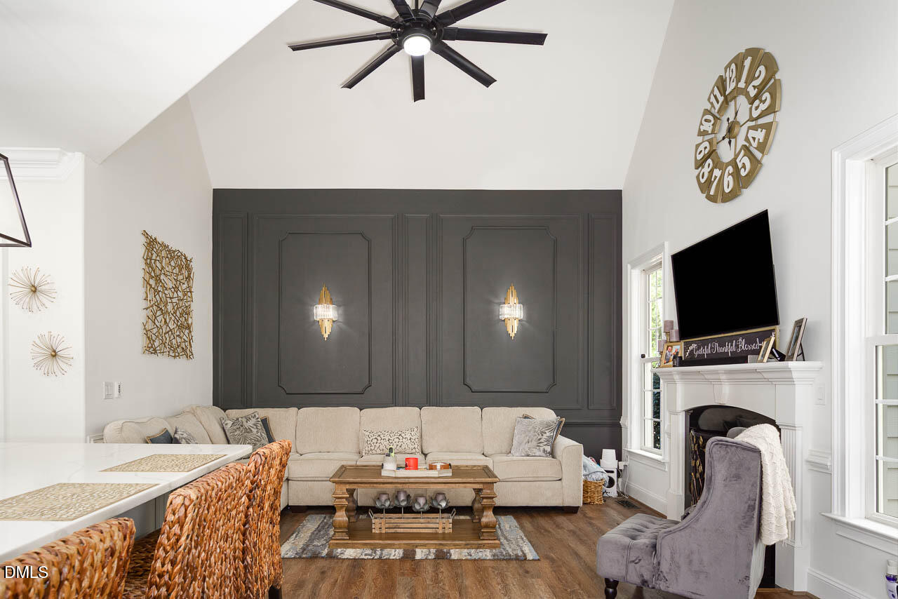 316 Chapel Ridge Drive Pittsboro, NC 27312 - Photo 42 of 69 a living room with furniture and a flat screen tv
