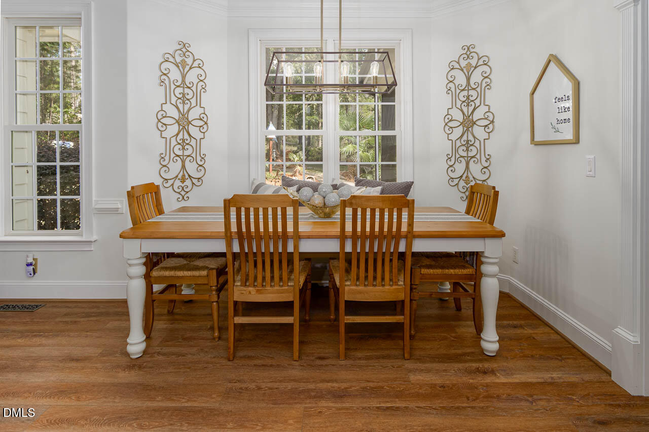 316 Chapel Ridge Drive Pittsboro, NC 27312 - Photo 43 of 69 a view of a dining room with furniture window and wooden floor
