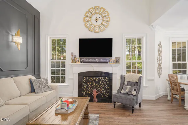 a spacious bedroom with a bed and wooden floor