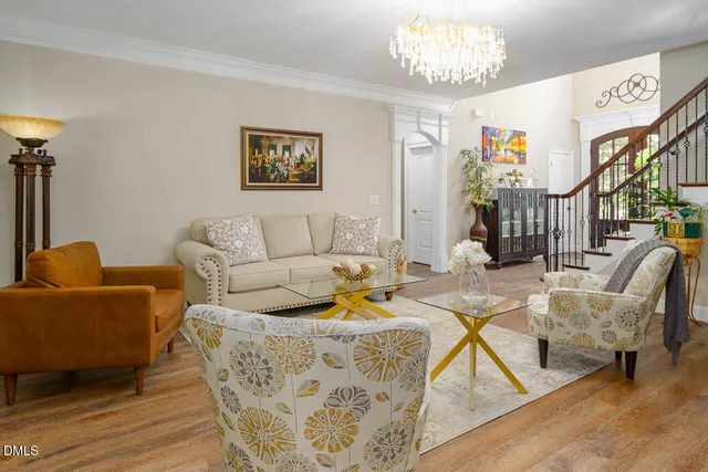 a living room with dining table and chairs