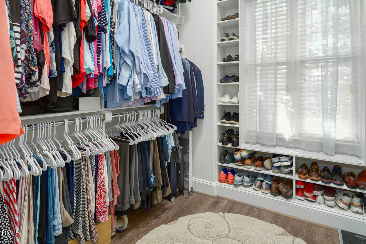 316 Chapel Ridge Drive Pittsboro, NC 27312 - Photo 53 of 69 a view of walk in closet with clothes and shoes