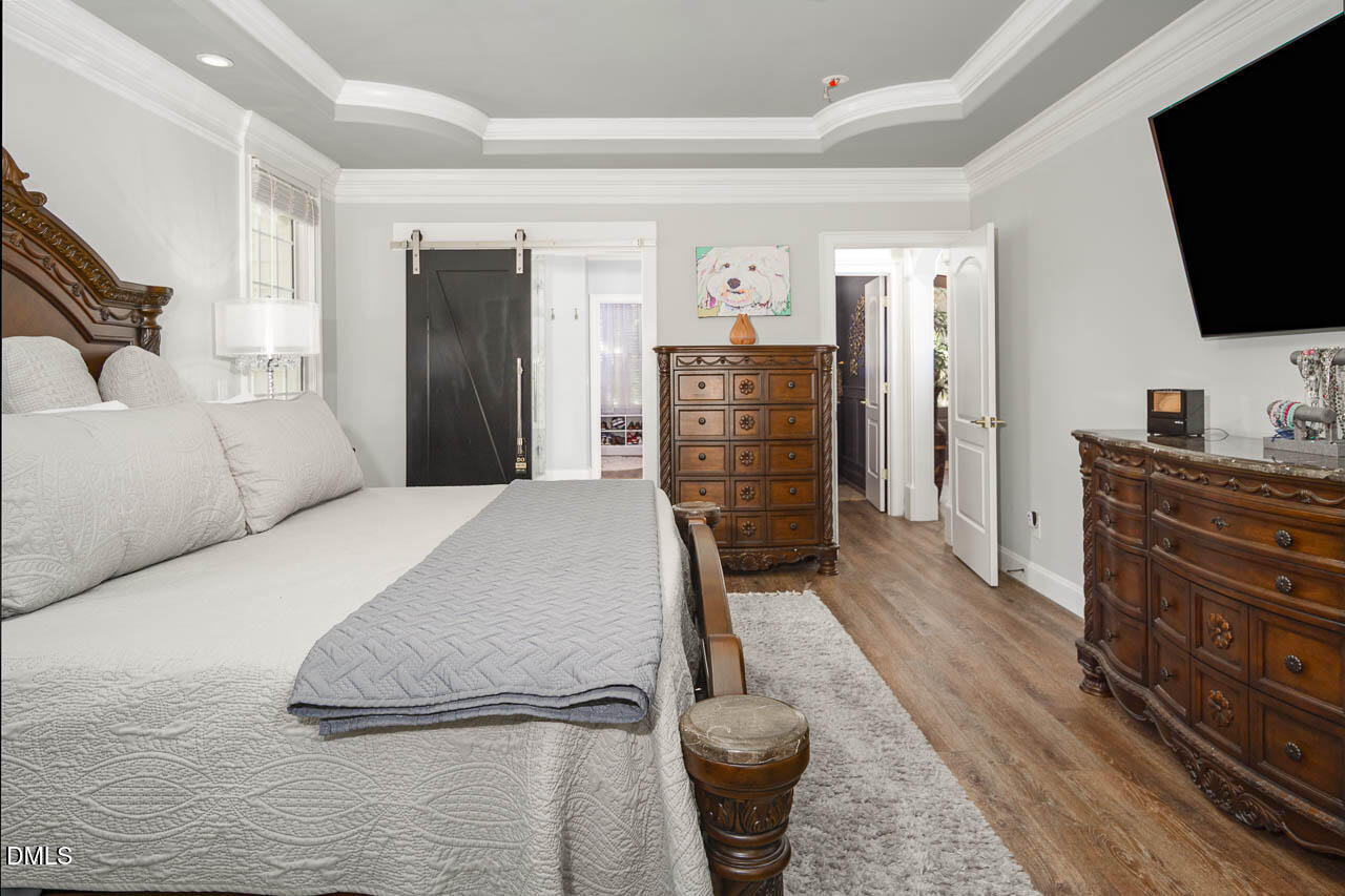 316 Chapel Ridge Drive Pittsboro, NC 27312 - Photo 57 of 69 a living room with furniture and a flat screen tv