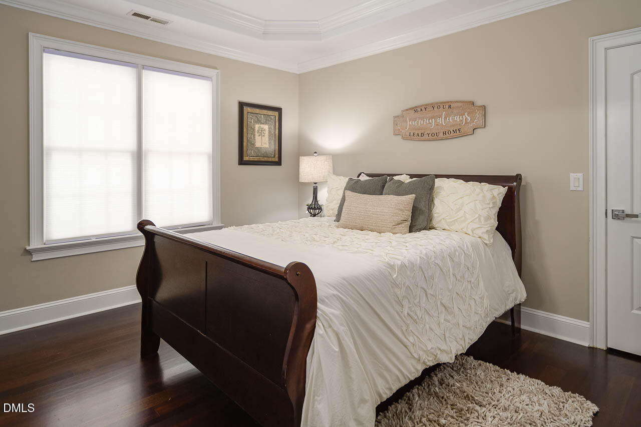 316 Chapel Ridge Drive Pittsboro, NC 27312 - Photo 64 of 69 a bedroom with a bed and a window