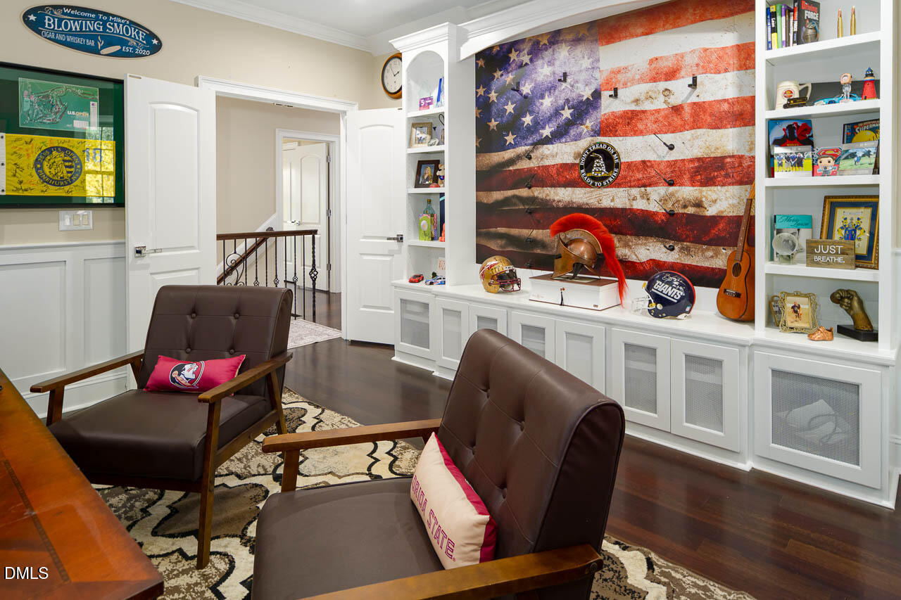 316 Chapel Ridge Drive Pittsboro, NC 27312 - Photo 65 of 69 a living room with furniture and a flat screen tv
