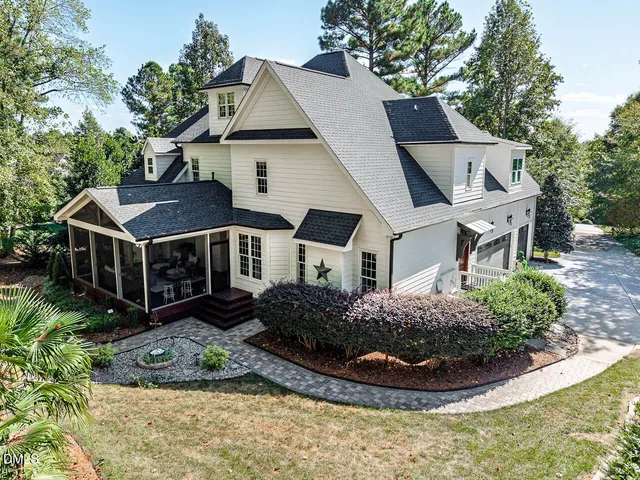 a front view of a house with lake view and sitting space