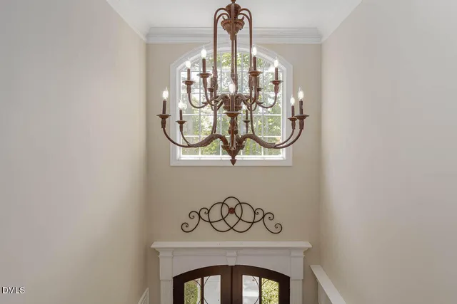 an aerial view of a house with swimming pool and wooden fence