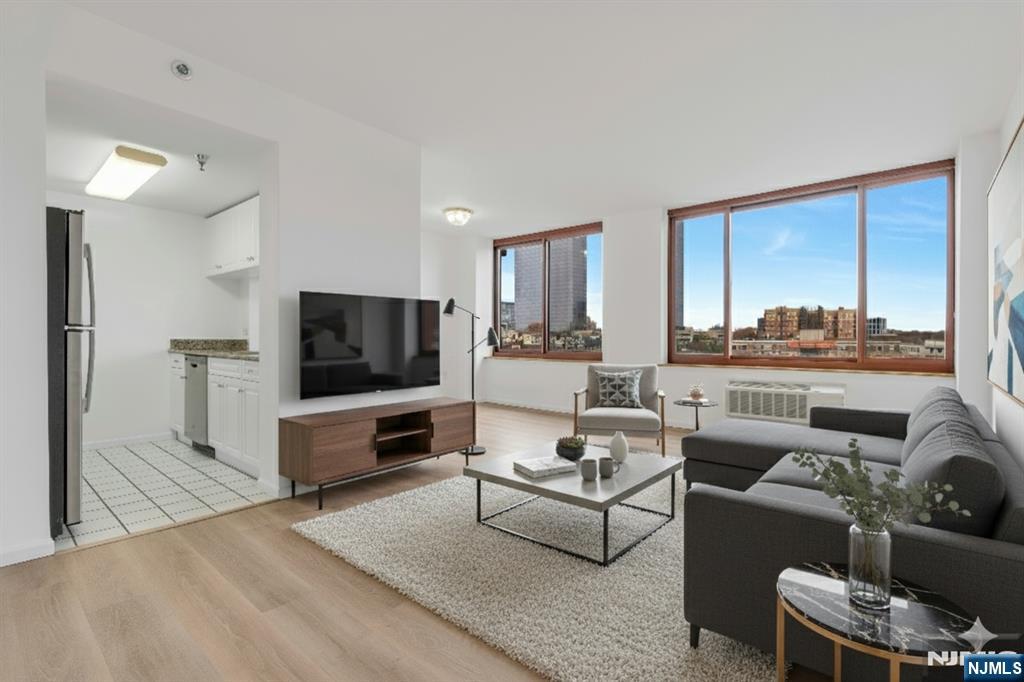100 Old Palisade Road, Unit 1814 Fort Lee, NJ 07024 - Photo 3 of 23 a living room with furniture and a flat screen tv