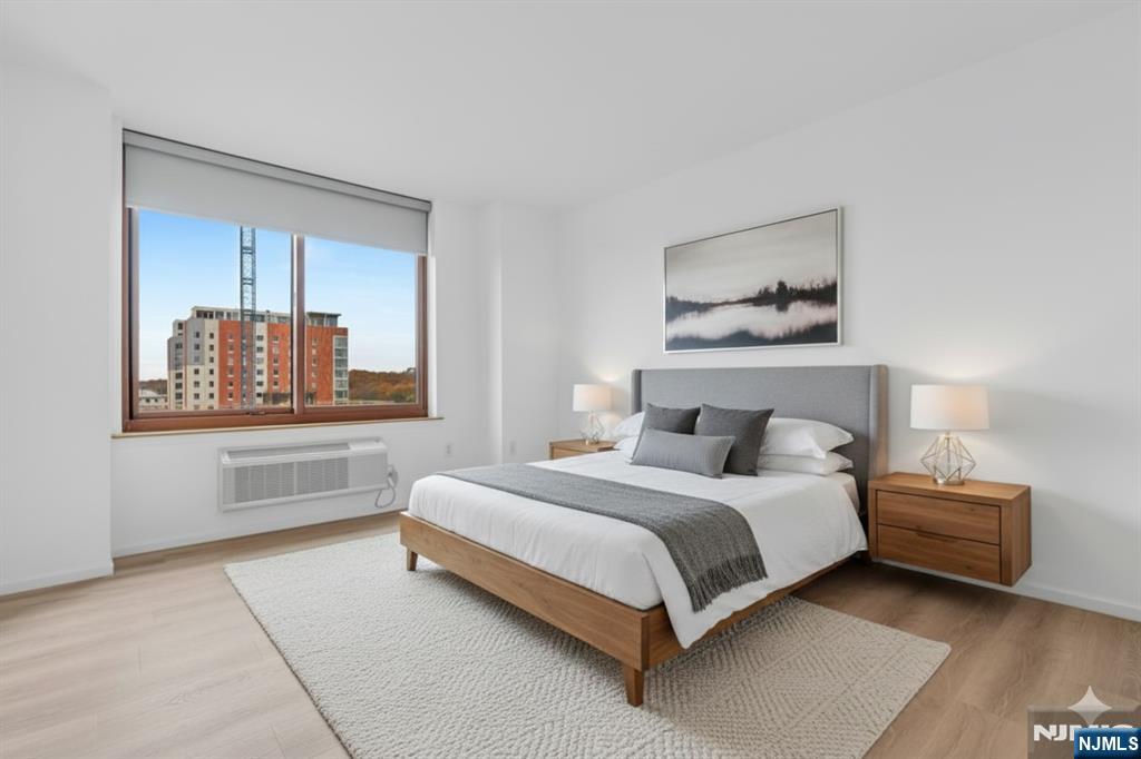 100 Old Palisade Road, Unit 1814 Fort Lee, NJ 07024 - Photo 9 of 23 a bedroom with a bed and window