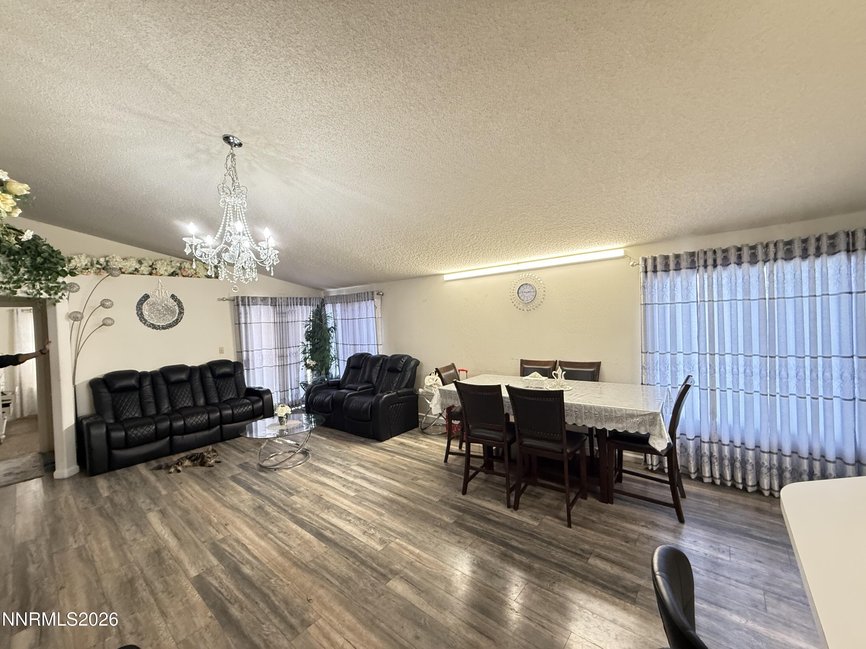 1585 Mescalero Avenue Reno, NV 89523 - Photo 6 of 13 a view of a livingroom with furniture window and wooden floor