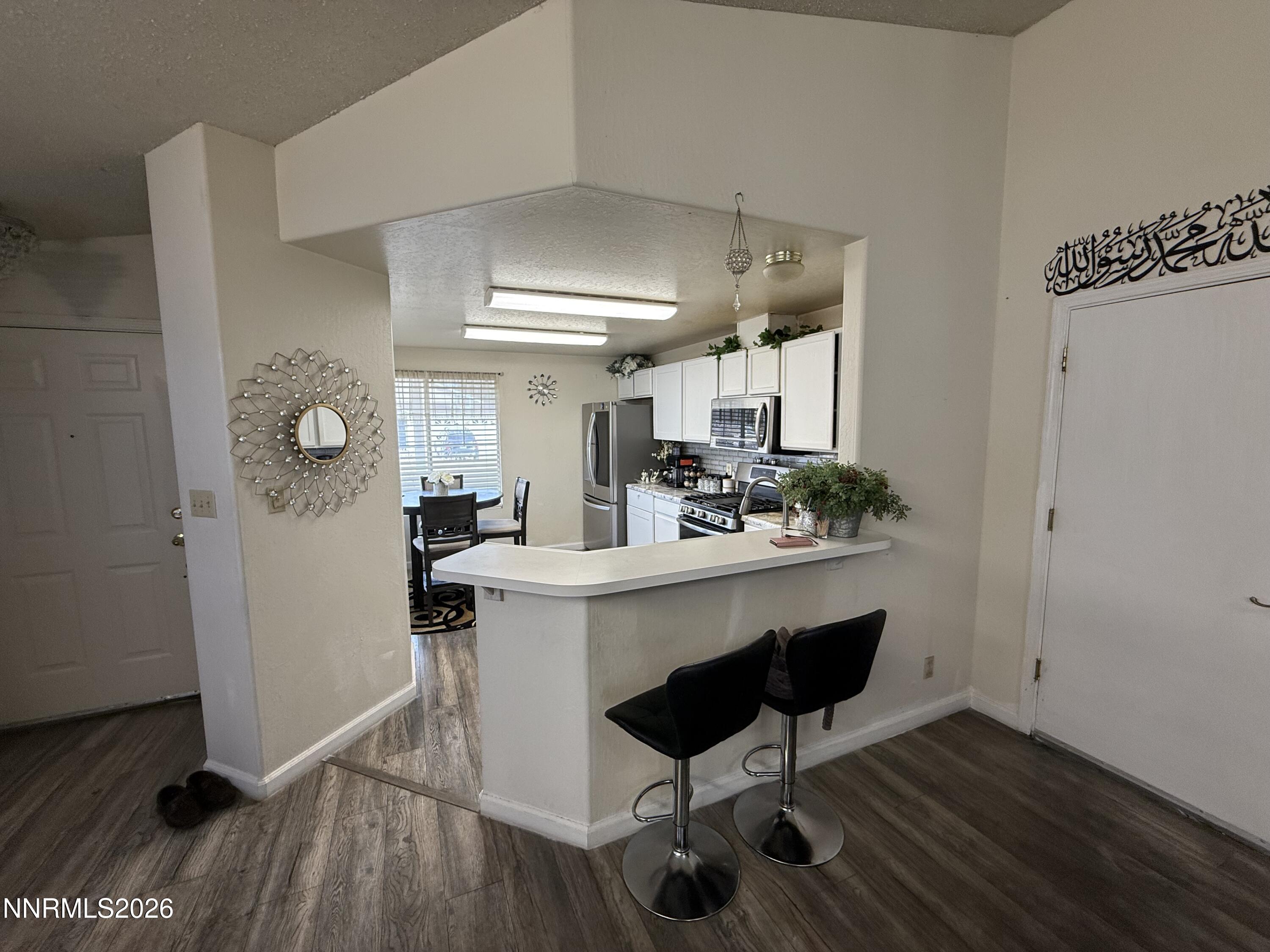 1585 Mescalero Avenue Reno, NV 89523 - Photo 10 of 13 a kitchen with a table and chairs in it