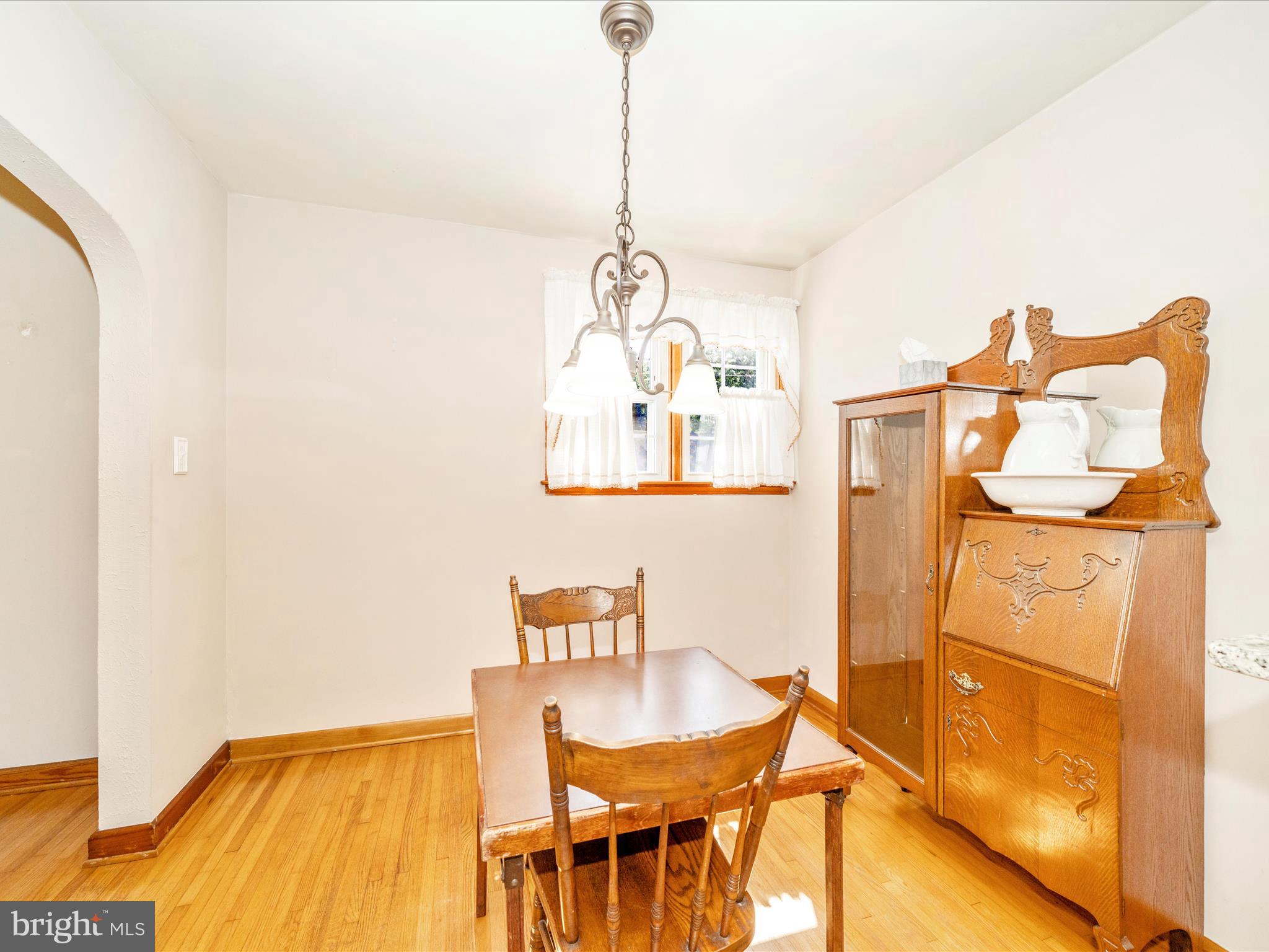 3707 North Point Road Dundalk, MD 21222 - Photo 12 of 56 a dining room with a table and chairs