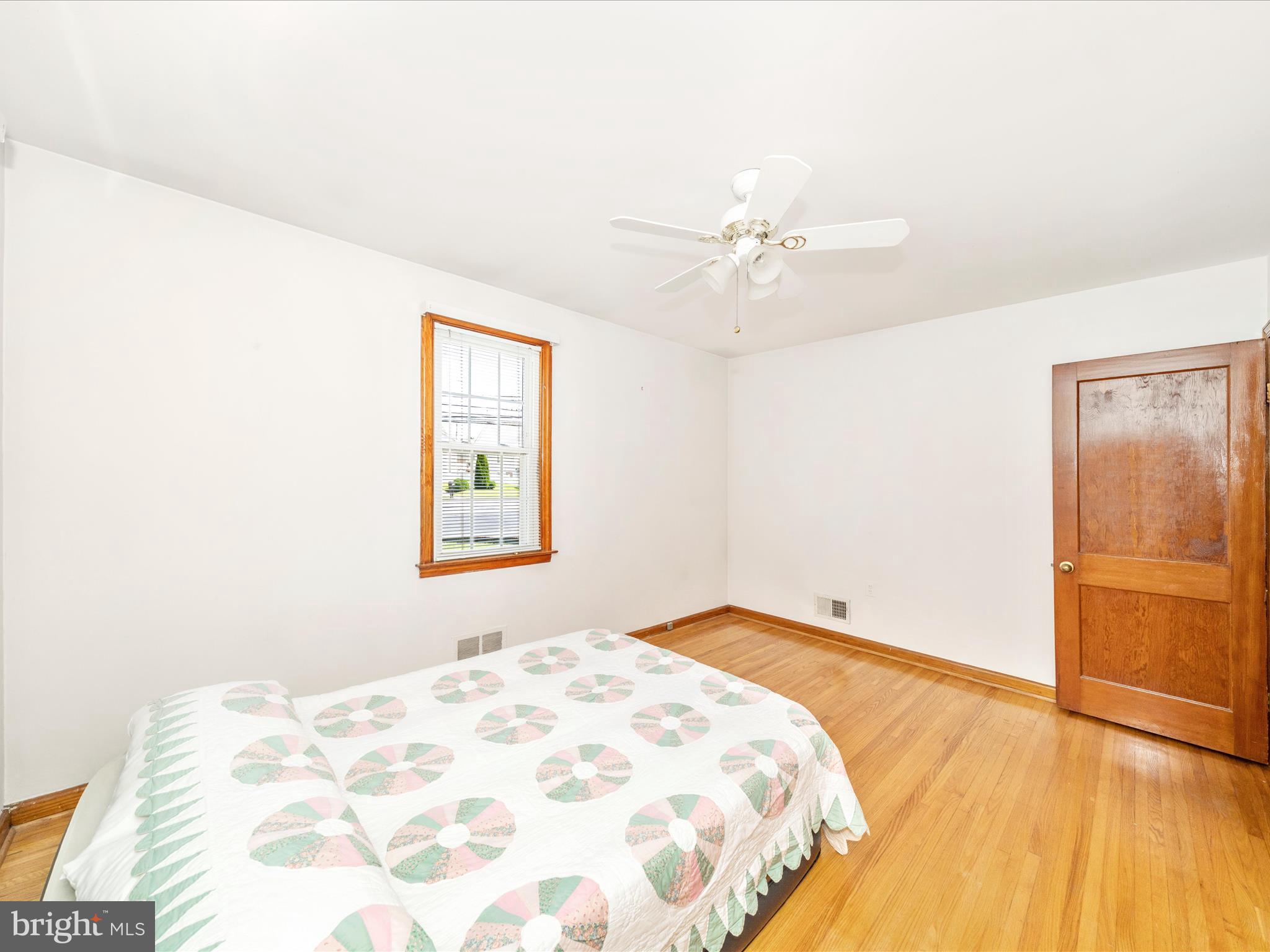 3707 North Point Road Dundalk, MD 21222 - Photo 32 of 56 a bedroom with a bed and a window