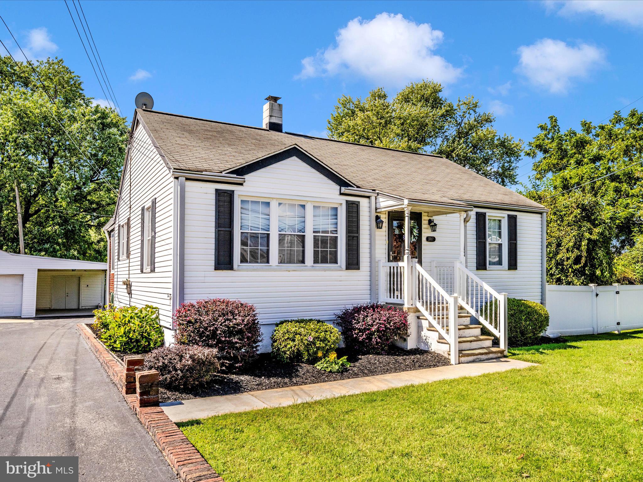 3707 North Point Road Dundalk, MD 21222 - Photo 53 of 56 a front view of a house with a garden and yard