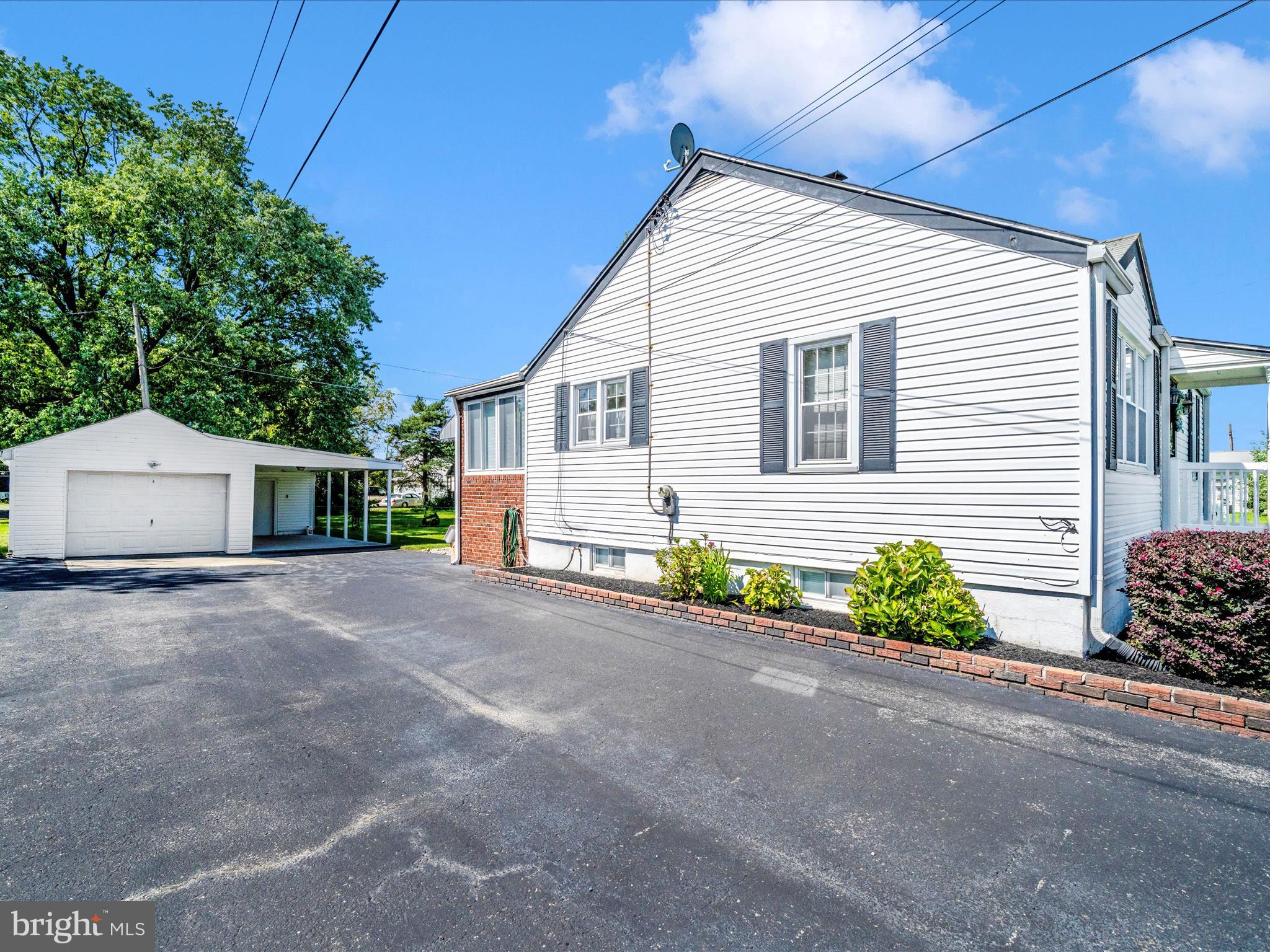 3707 North Point Road Dundalk, MD 21222 - Photo 55 of 56 a front view of a house with a yard and potted plants