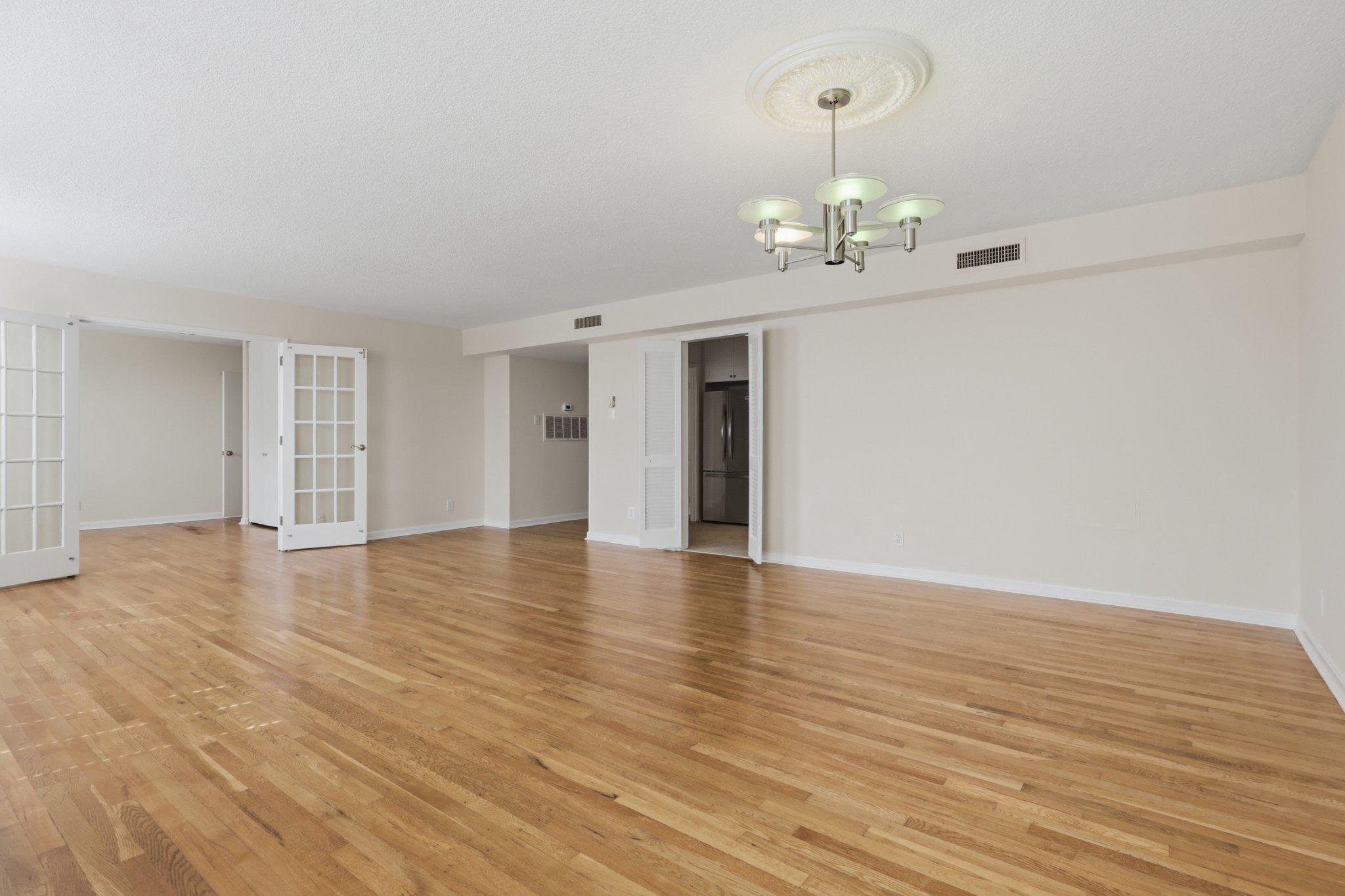 1101 St Paul Street, Unit 1212 Baltimore, MD 21202 - Photo 20 of 36 Spacious, sunlit open living/dining area.