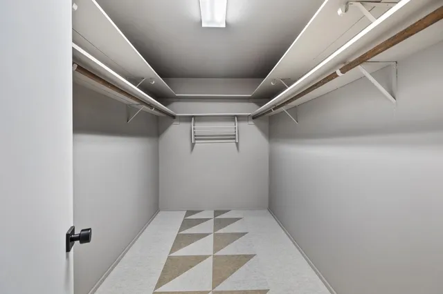 a bathroom with a sink a toilet a shower and mirror