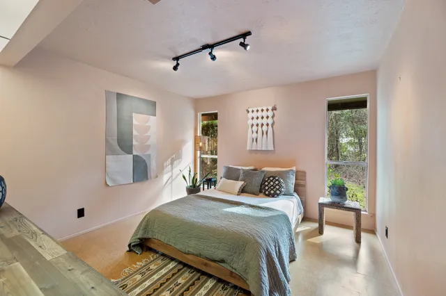 a bedroom with a bed and a dresser