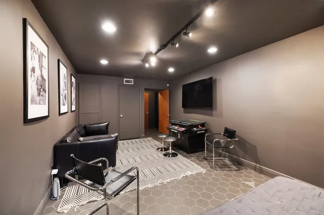 a view of a patio with a table chairs and a potted plant