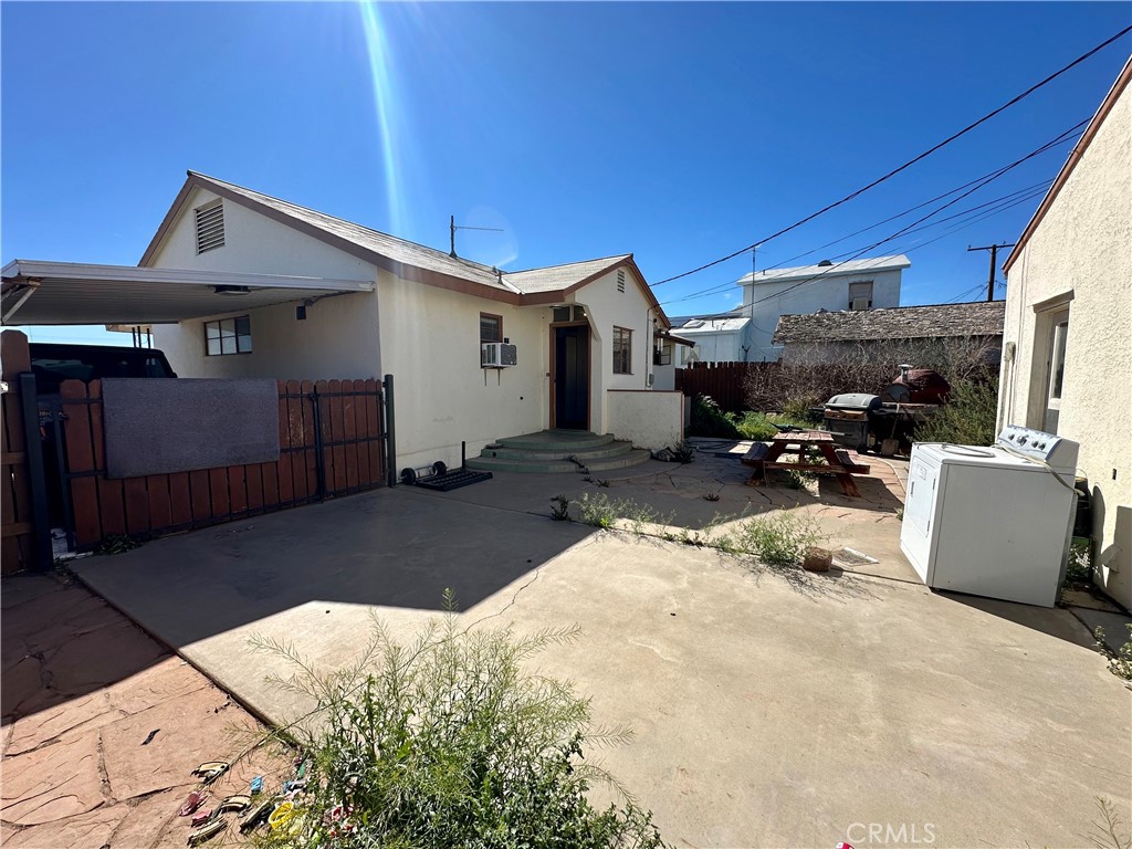 1602 Collins Street Needles, CA 92363 - Photo 18 of 18 a view of a house with a patio