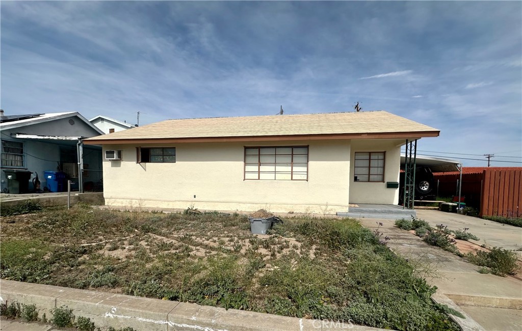 1602 Collins Street Needles, CA 92363 - Photo 2 of 18 a front view of a house with yard