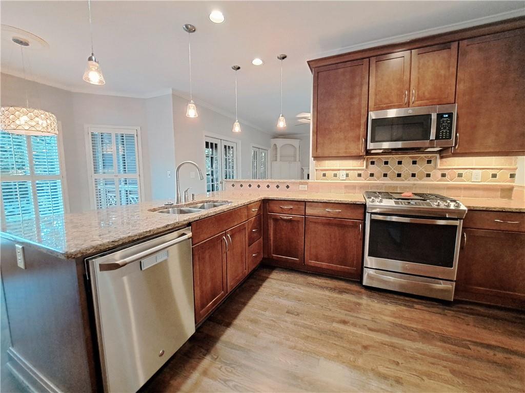 2242 Lenox Walk Northeast Atlanta, GA 30319 - Photo 20 of 80 a kitchen with stainless steel appliances a stove sink and microwave