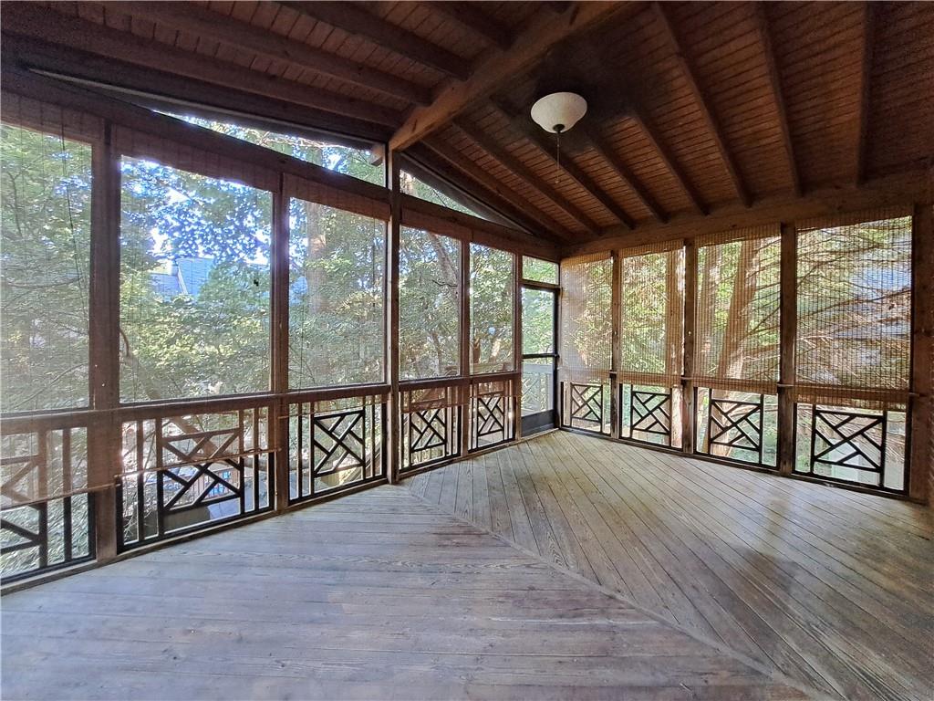 2242 Lenox Walk Northeast Atlanta, GA 30319 - Photo 22 of 80 a view of an empty room with wooden floor and iron stairs