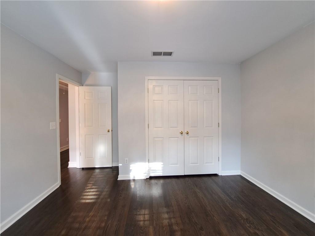 2242 Lenox Walk Northeast Atlanta, GA 30319 - Photo 30 of 80 a view of wooden floor and brick walls