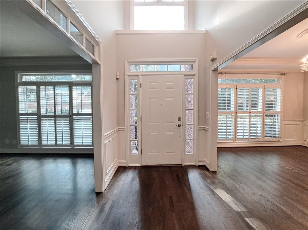 2242 Lenox Walk Northeast Atlanta, GA 30319 - Photo 3 of 80 an empty room with wooden floor and windows