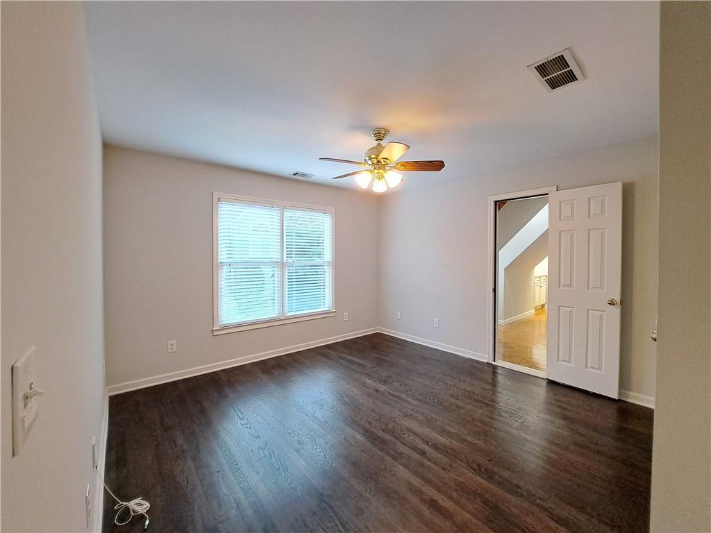 2242 Lenox Walk Northeast Atlanta, GA 30319 - Photo 33 of 80 a view of an empty room with wooden floor and a window