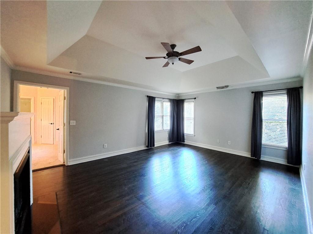 2242 Lenox Walk Northeast Atlanta, GA 30319 - Photo 37 of 80 a view of empty room with wooden floor and fan
