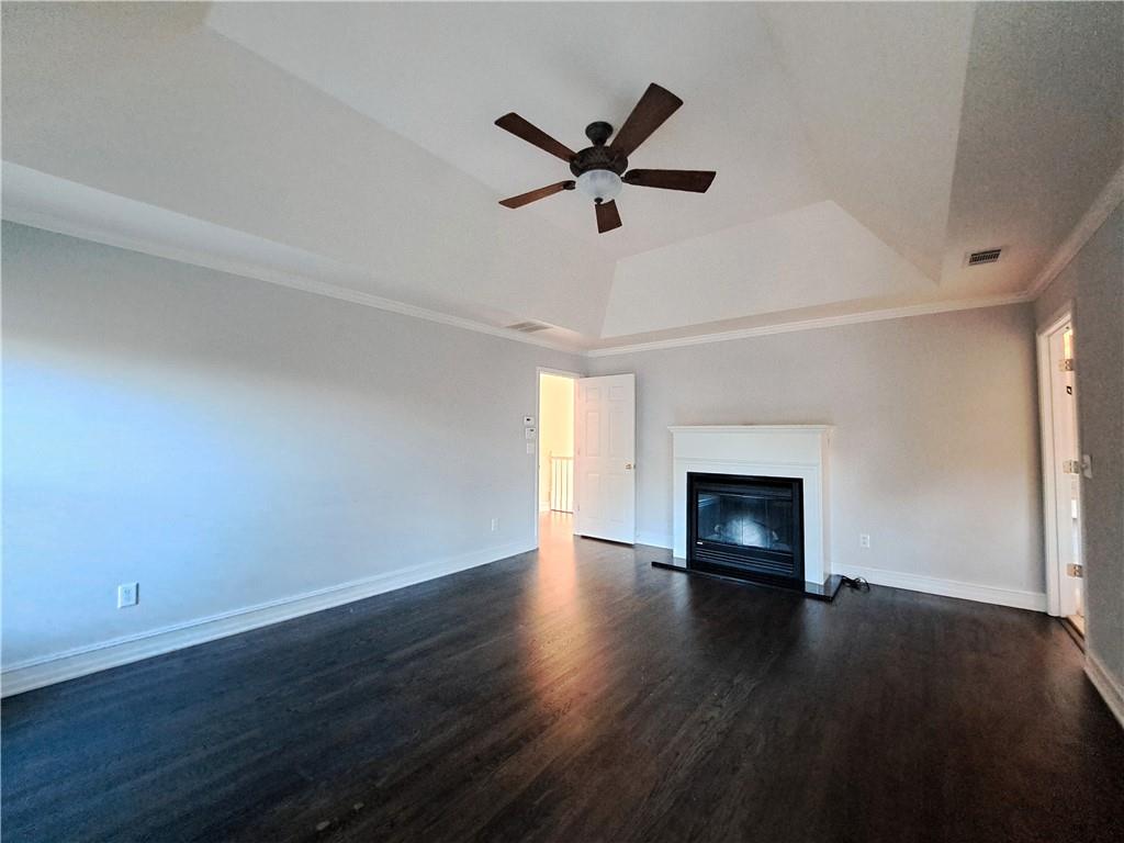 2242 Lenox Walk Northeast Atlanta, GA 30319 - Photo 38 of 80 a view of empty room with wooden floor and fireplace