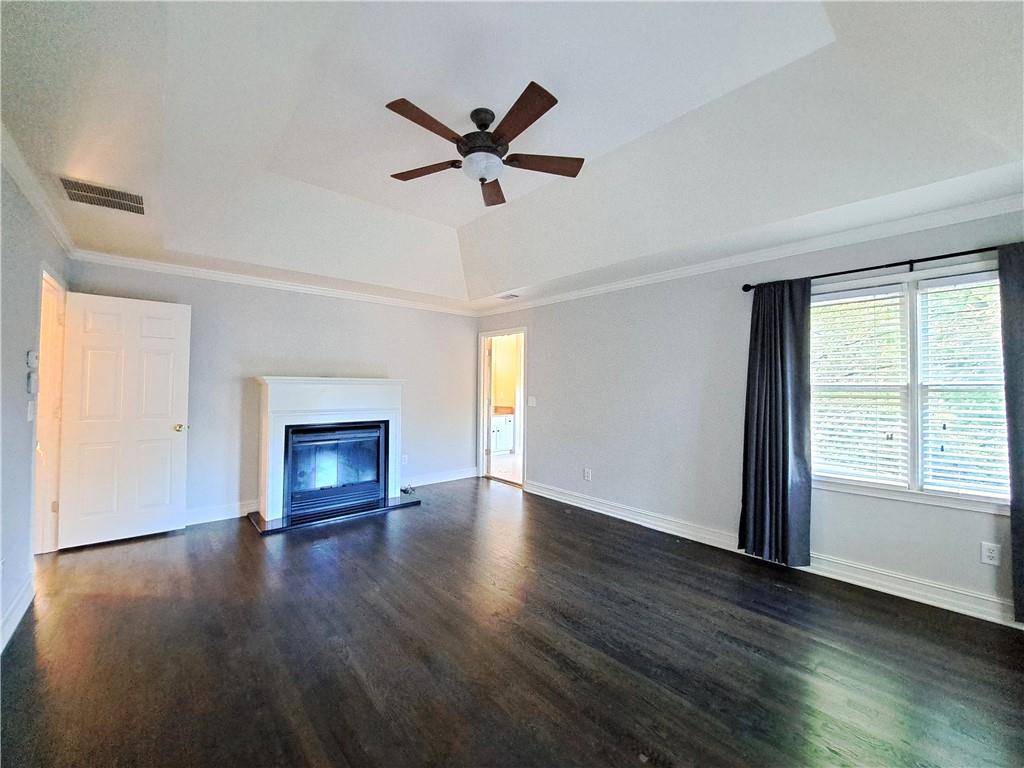 2242 Lenox Walk Northeast Atlanta, GA 30319 - Photo 40 of 80 a view of empty room with wooden floor and fan