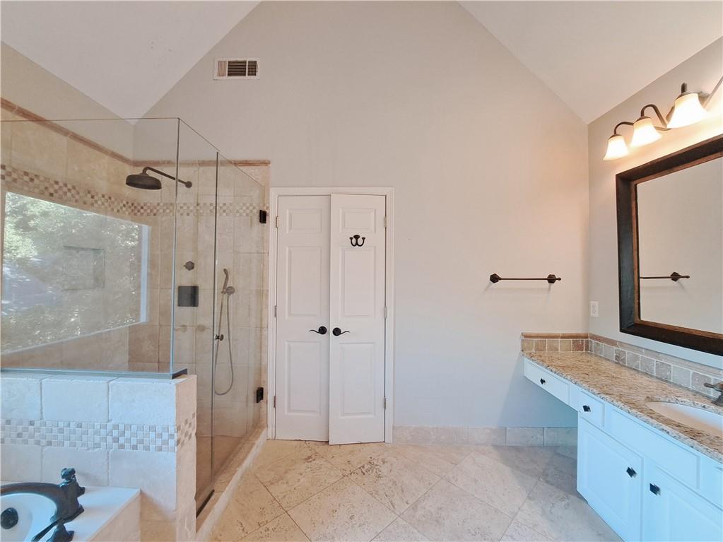 2242 Lenox Walk Northeast Atlanta, GA 30319 - Photo 43 of 80 a spacious bathroom with a granite countertop sink mirror and shower