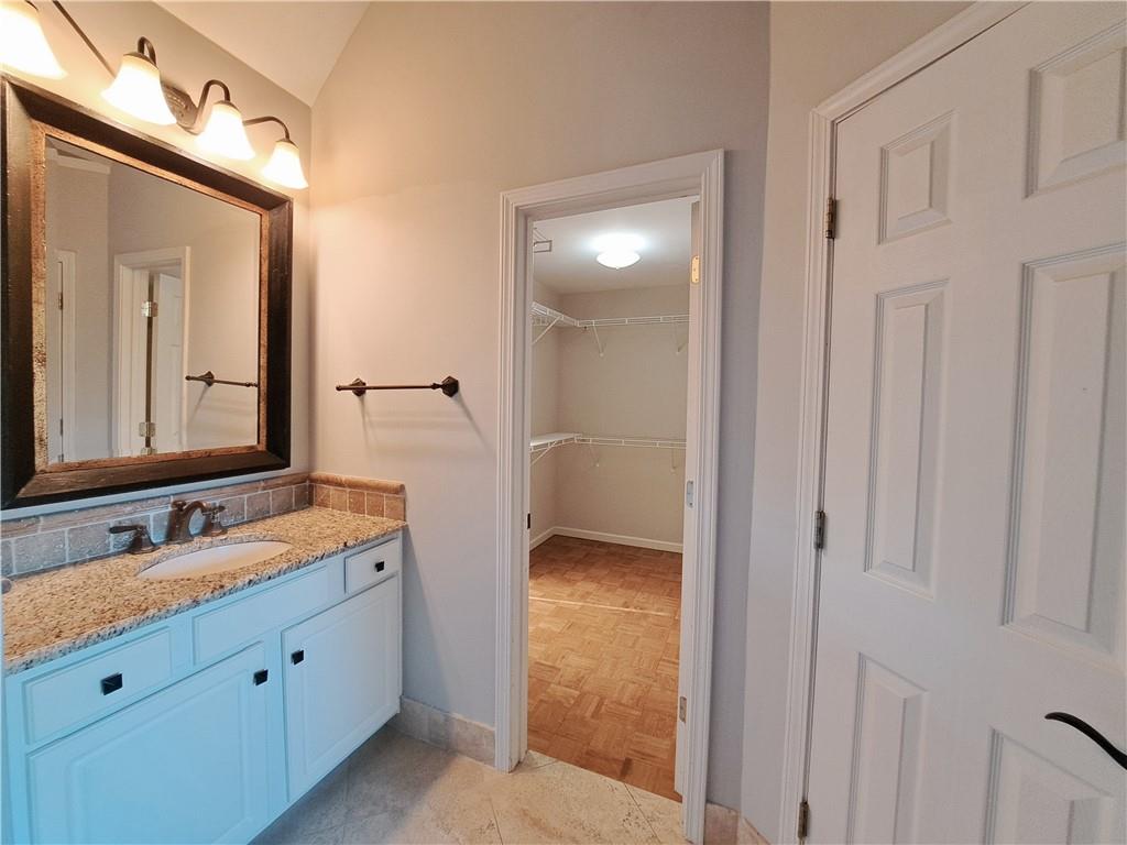 2242 Lenox Walk Northeast Atlanta, GA 30319 - Photo 46 of 80 a spacious bathroom with a granite countertop sink mirror and a