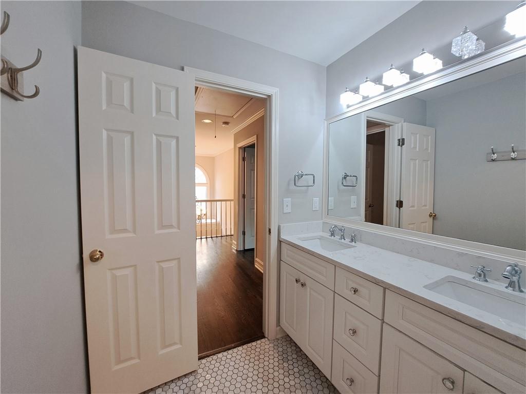 2242 Lenox Walk Northeast Atlanta, GA 30319 - Photo 52 of 80 a spacious bathroom with a double vanity sink a mirror and a shower