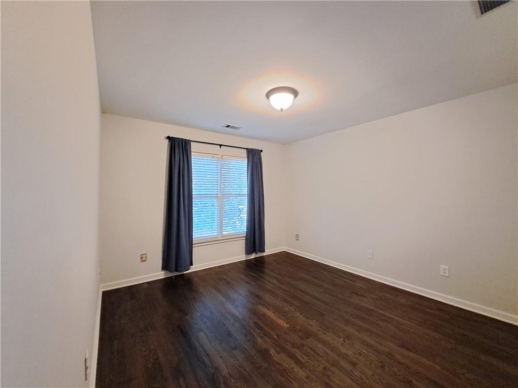 2242 Lenox Walk Northeast Atlanta, GA 30319 - Photo 53 of 80 an empty room with wooden floor and windows