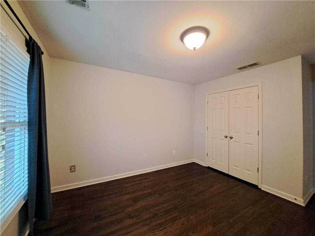 2242 Lenox Walk Northeast Atlanta, GA 30319 - Photo 54 of 80 a view of a room with wooden floor and window