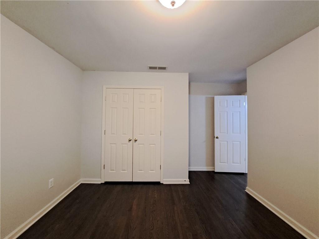 2242 Lenox Walk Northeast Atlanta, GA 30319 - Photo 55 of 80 a view of an empty room and wooden floor