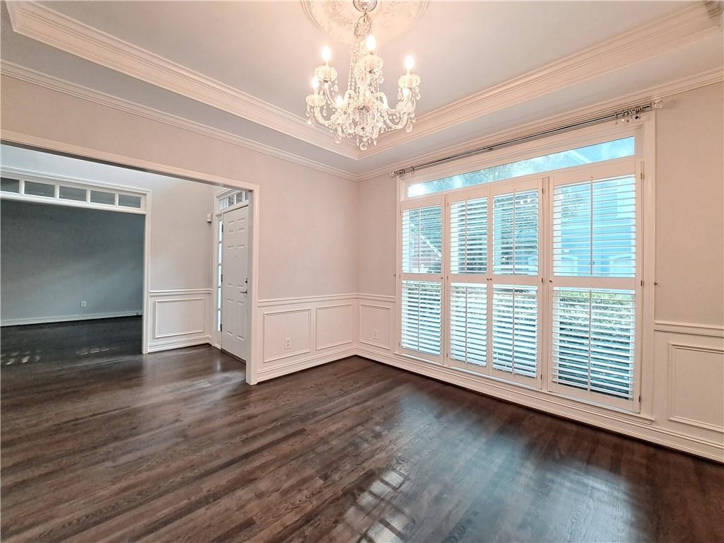 2242 Lenox Walk Northeast Atlanta, GA 30319 - Photo 6 of 80 a view of an empty room with wooden floor and a window