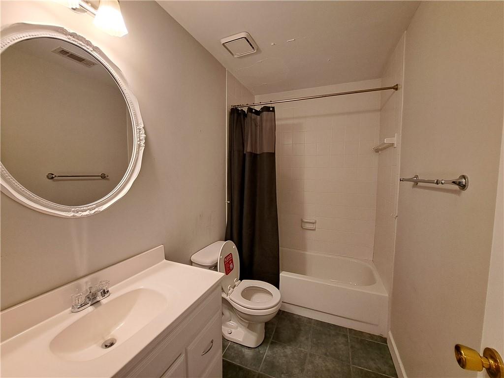 2242 Lenox Walk Northeast Atlanta, GA 30319 - Photo 64 of 80 a bathroom with a toilet a sink and bathtub